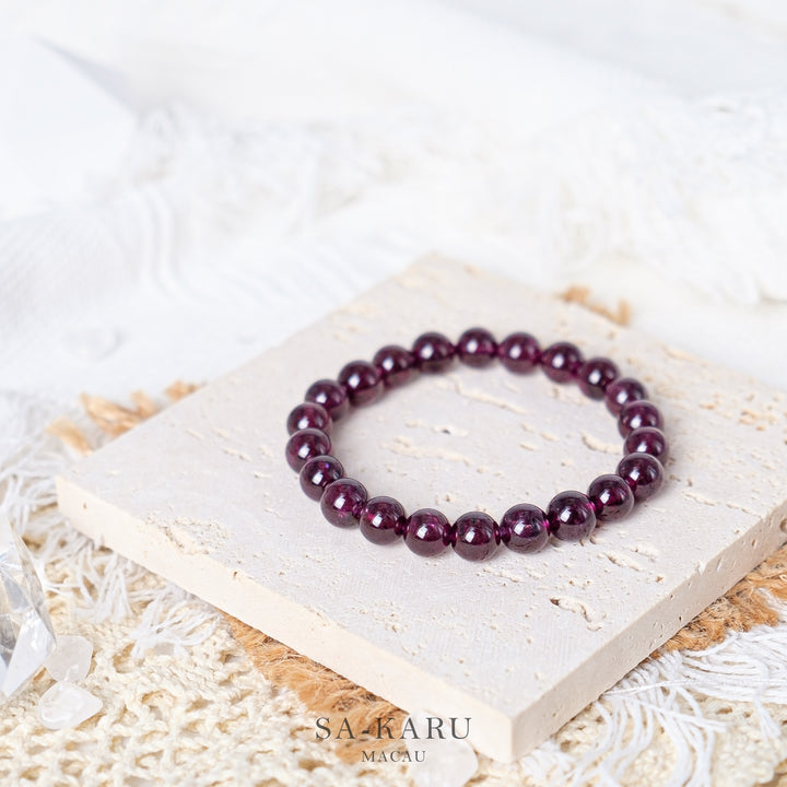 Purple tooth black garnet bracelet